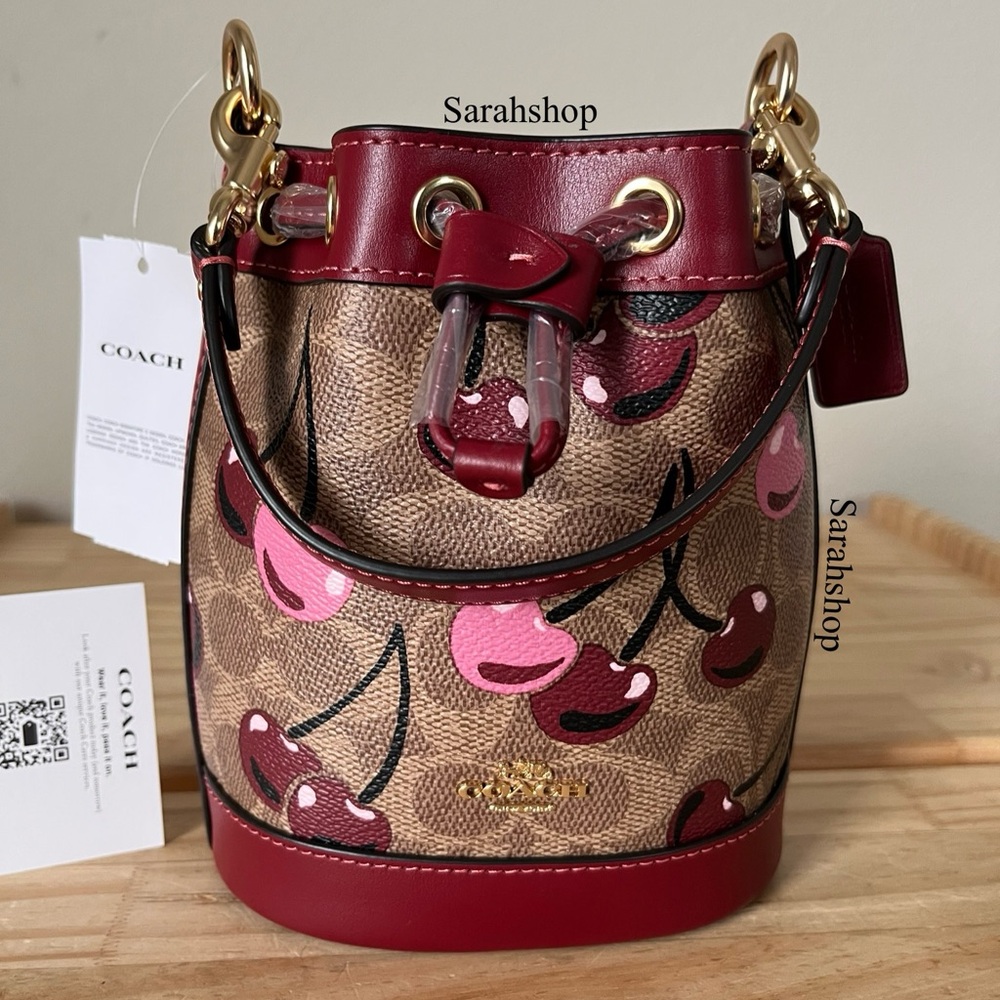 ✅Coach Mini Bucket Bag In Signature Cherry Print
